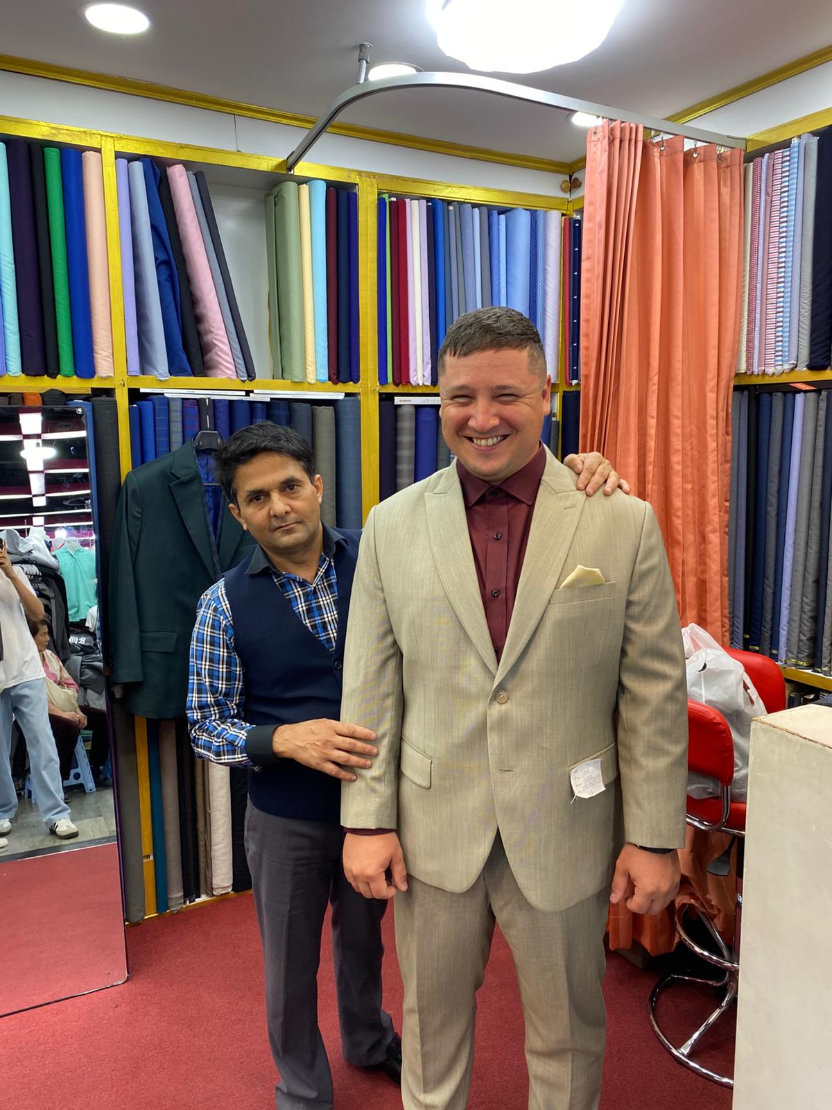 Happy client in custom tailored suit at King Fashion Uni Bangkok